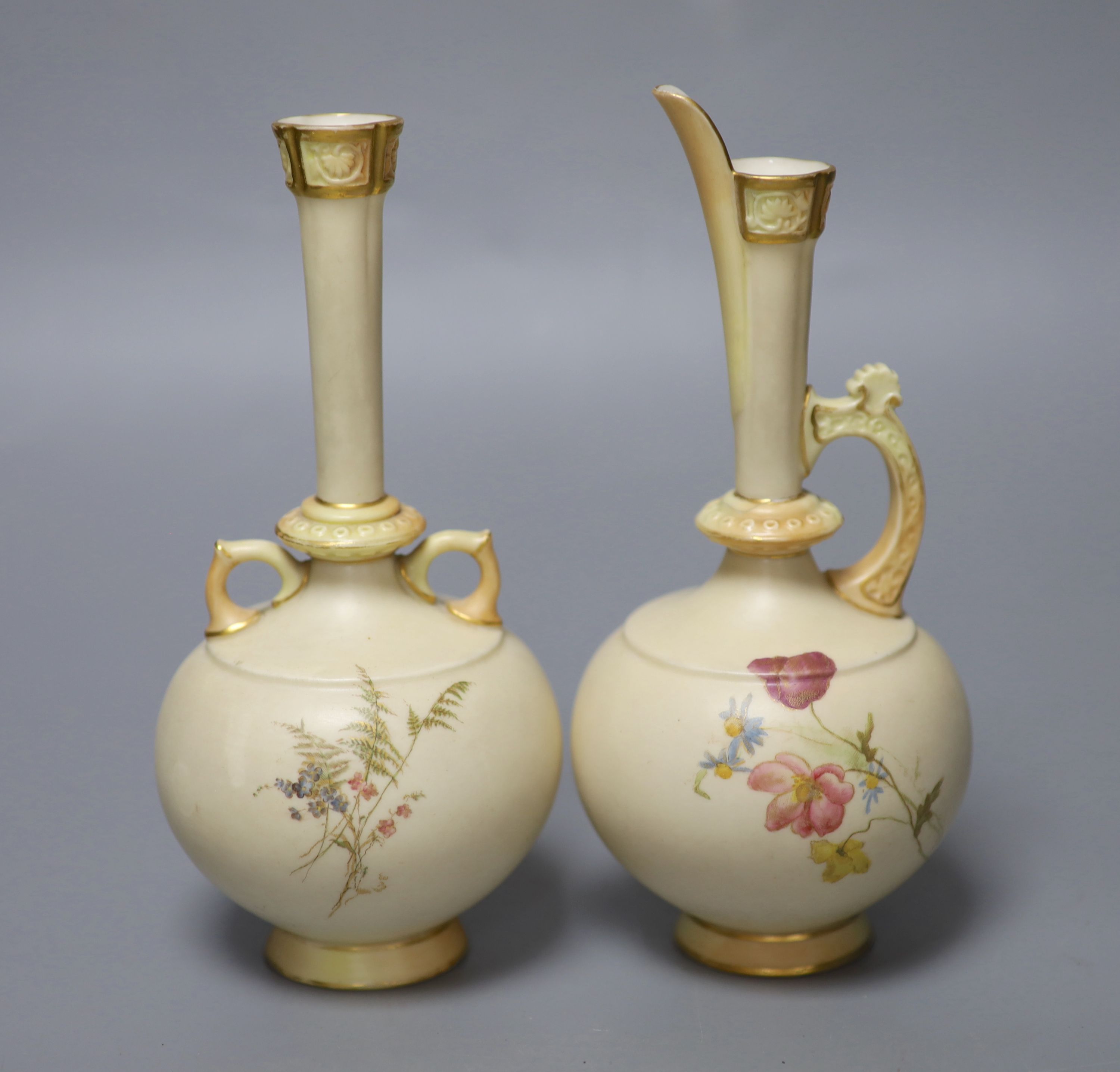 A Royal Worcester blue ivory two handled vase painted and gilded with flowers and a similar ewer, green marks, both date codes 1893, 19